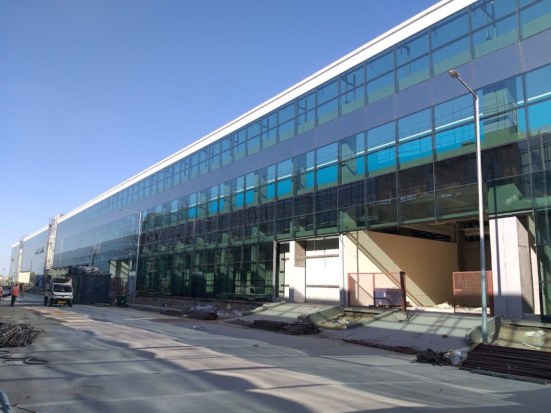 Blue reflective curtain wall glazing at Asahi India Glass, Mehsana