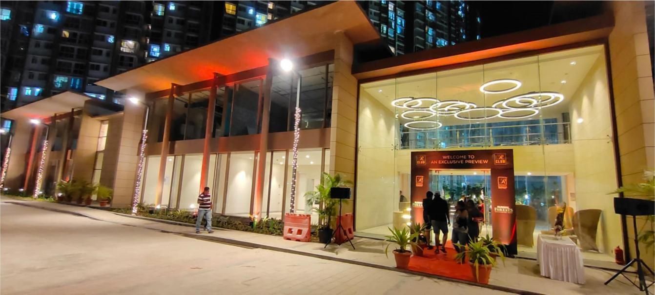 Club House at Runwal Forest, Mumbai, with spider glazing and ACP cladding, lit at night